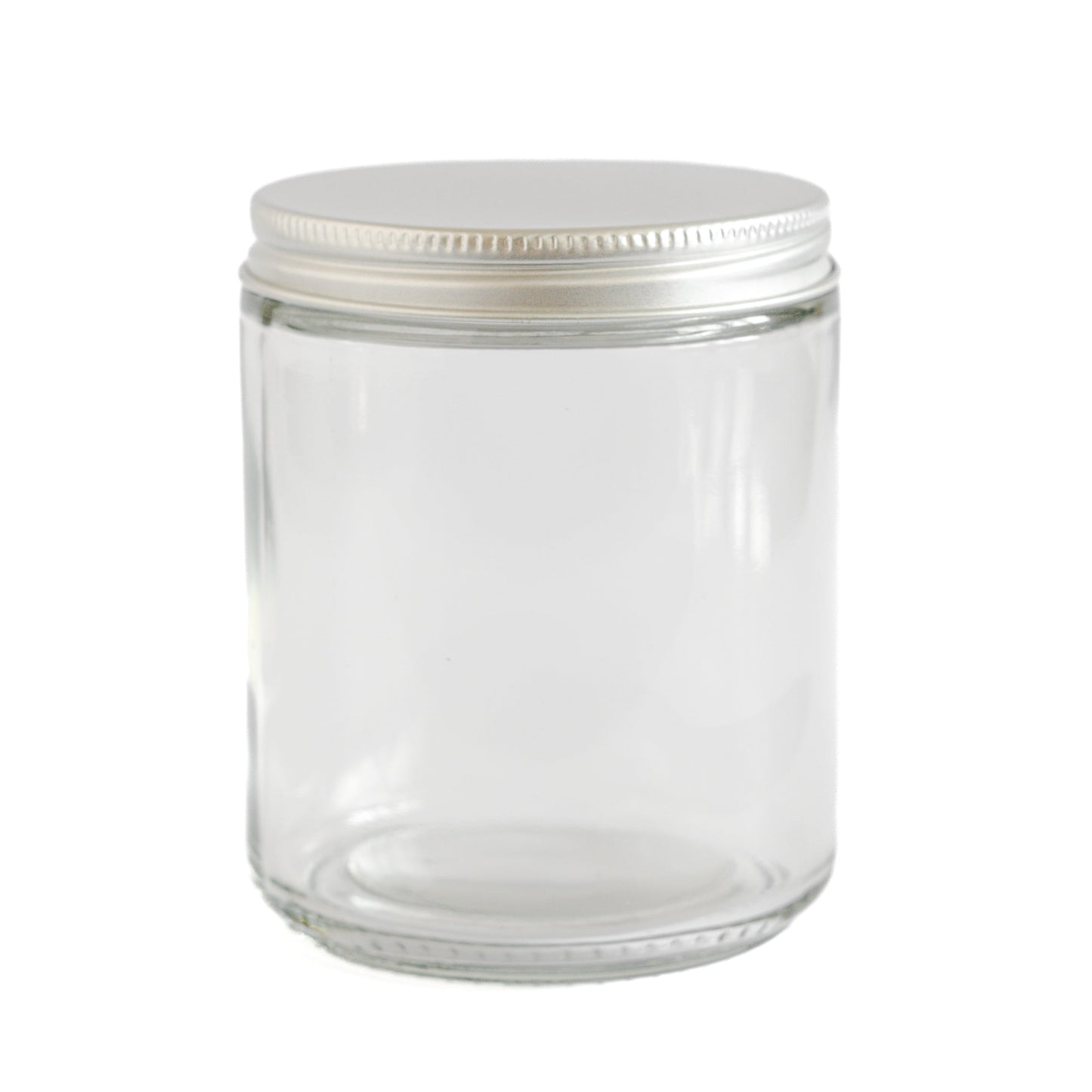 Clear glass jar with a white lid on a white background