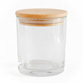 Clear glass jar with a wooden lid on a white background