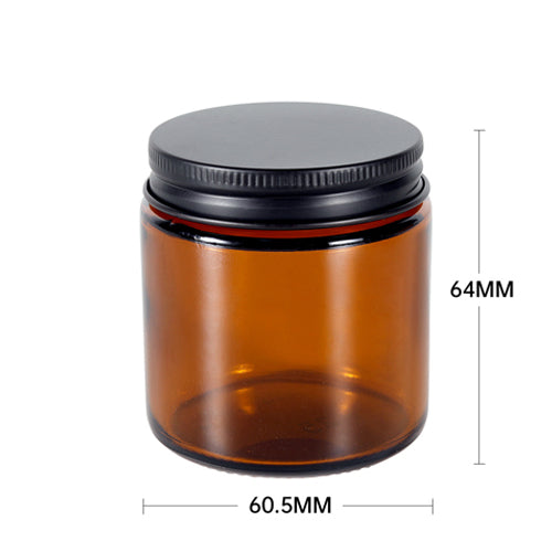 Amber glass jar with black lid and measurements on a white background