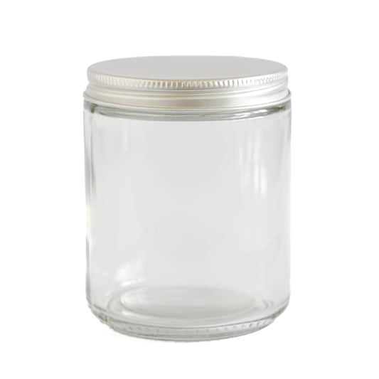 Clear glass jar with a white lid on a white background